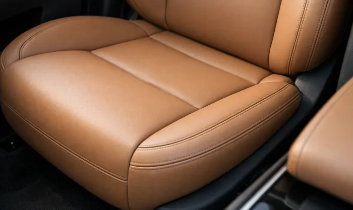 After Seat Foam Restoration and Leather Repainting on Tan Leather Seat With Collapsed Foam in Los Angeles