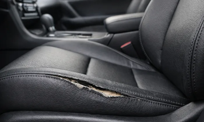 Before Driver Seat Bolster Reupholstery on Black Genuine Leather Driver Seat in Los Angeles