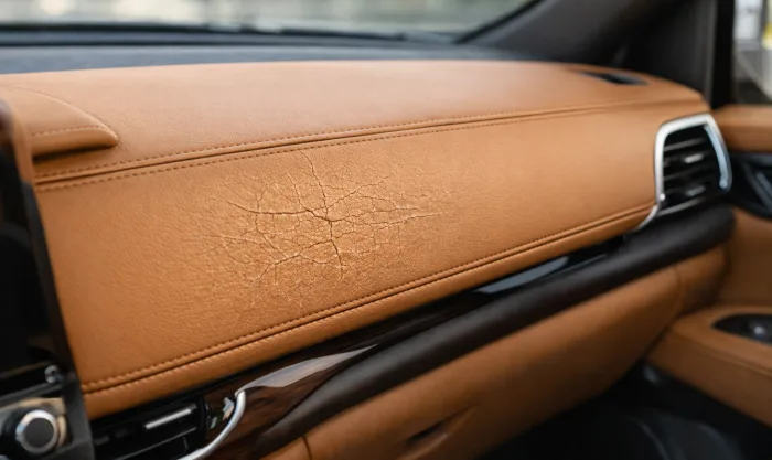 Before Crack Repair on Leather Dashboard Panel in Los Angeles