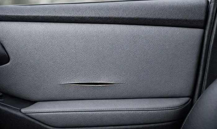 Before Clean Cut Repair on Faux Leather Door Panel in Los Angeles