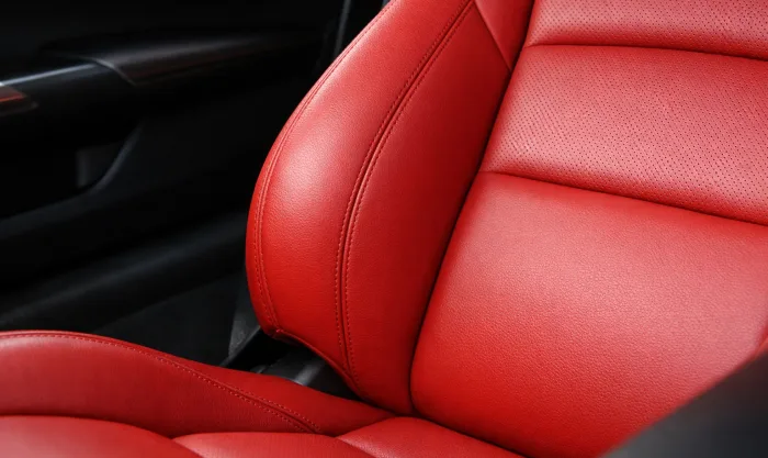 After Side Bolster Foam Deformation Repair on Red Genuine Leather Seat Side Support in Los Angeles