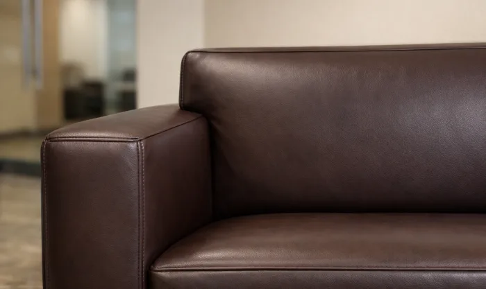 After Lobby Sofa Scratch and Scuff Repair After Office Relocation for Dark Brown Pigmented Leather Lobby Sofa in Los Angeles
